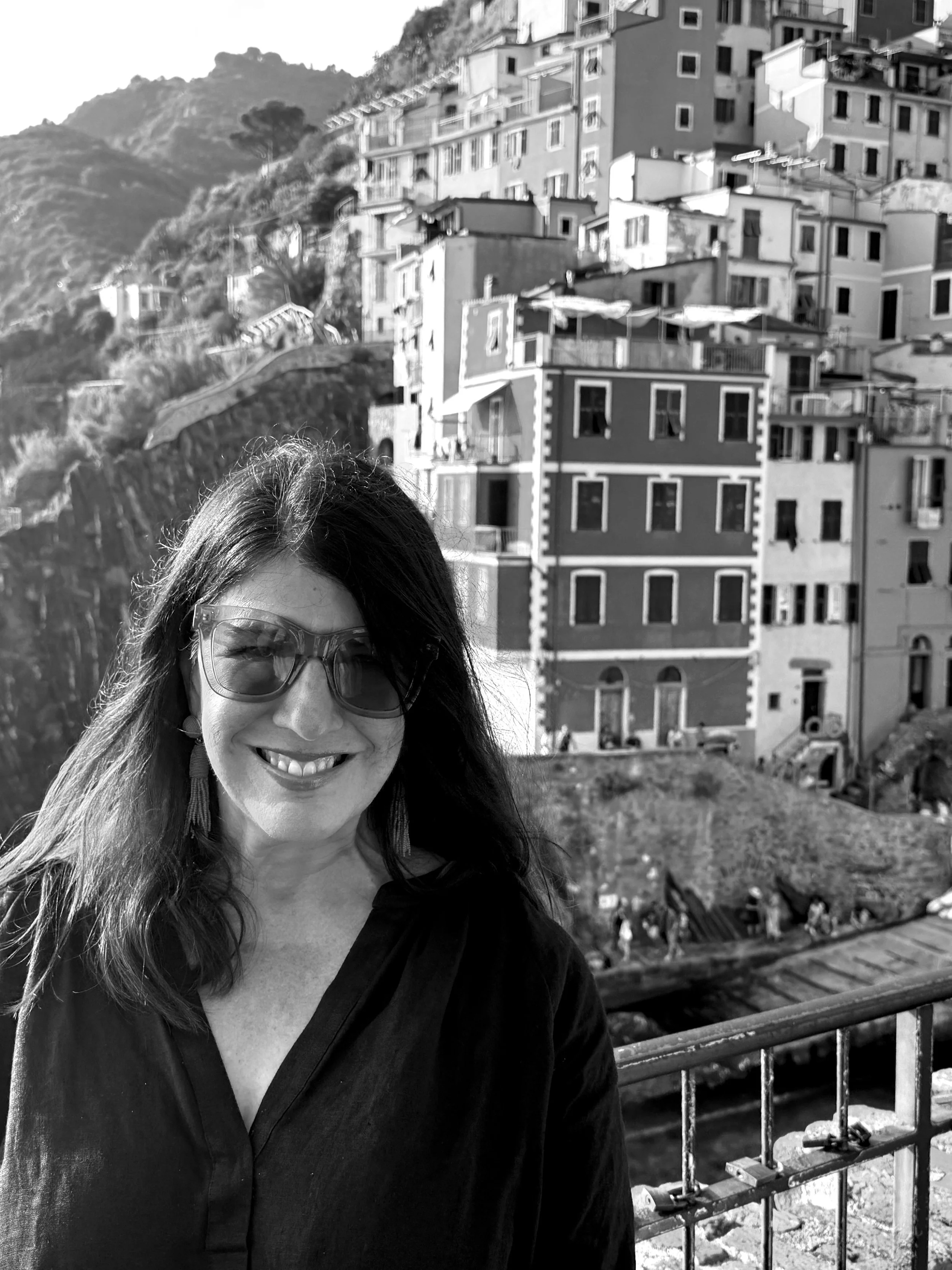 Image of Lisa Bellew in Cinque Terre in a black-and-white photo.