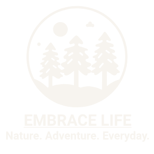 A circular logo featuring a sun, stars, mountains, and pine trees, with the text 'Embrace Life' and the tagline 'Nature. Adventure. Everyday.'