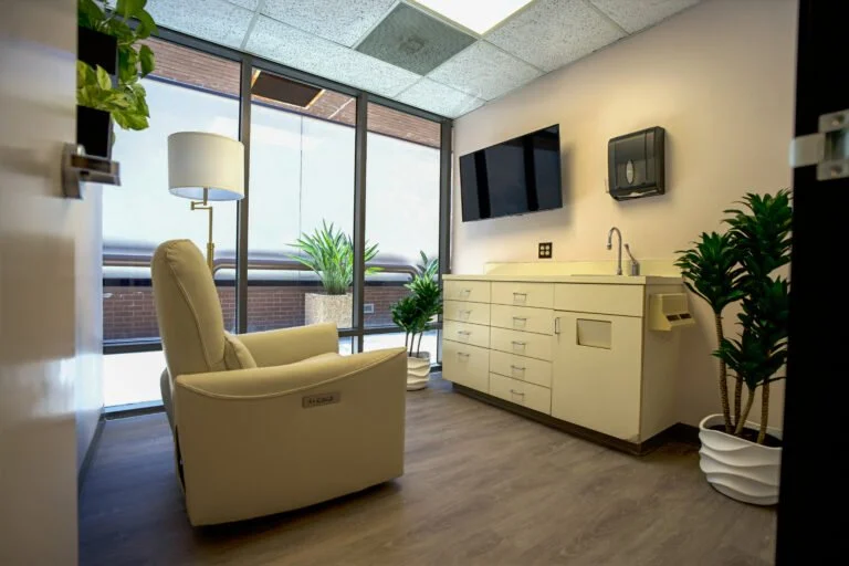 Doctors office with patient chair and tv