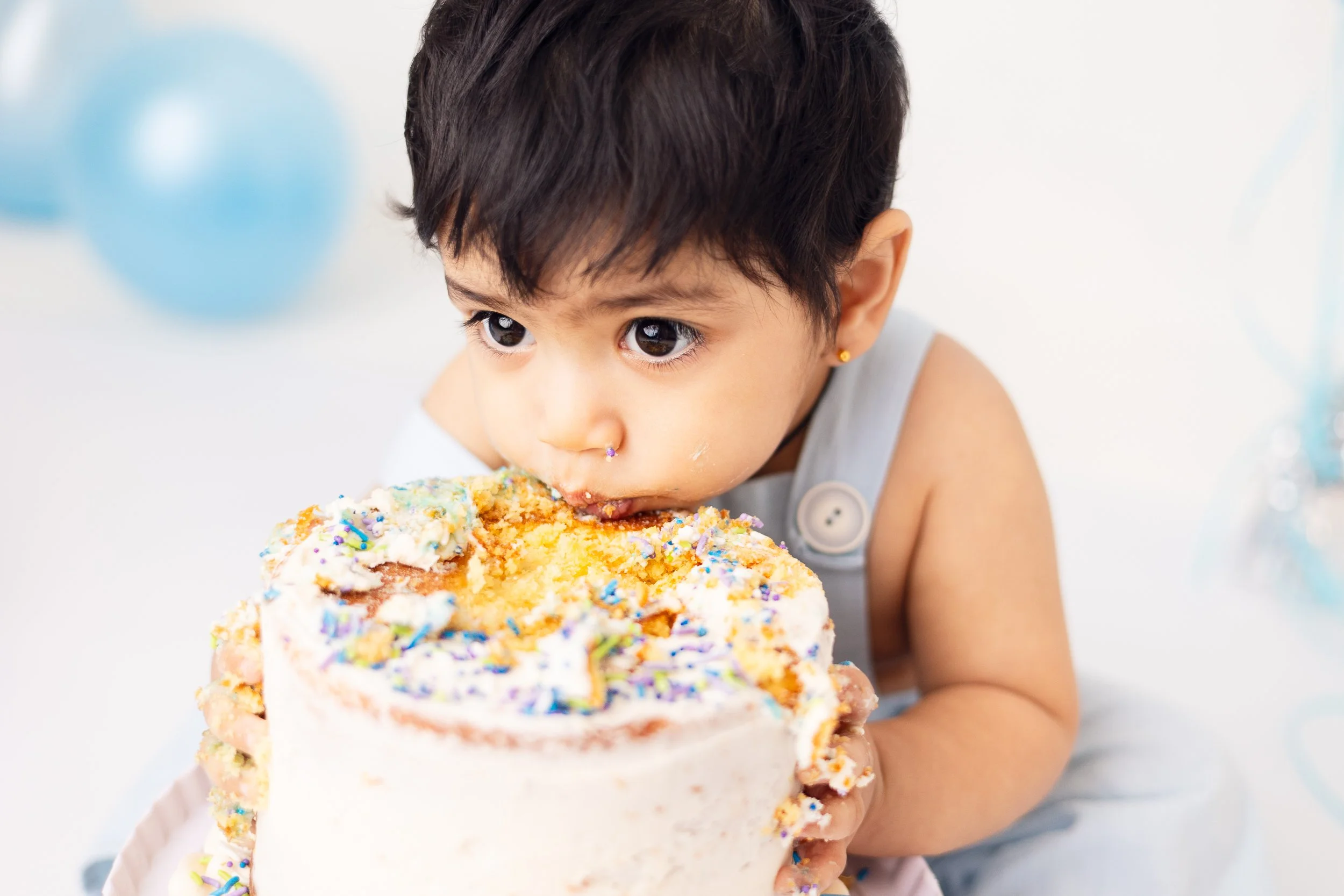 cake smash session for one year old boy face in cake in my Cordova Bay studio