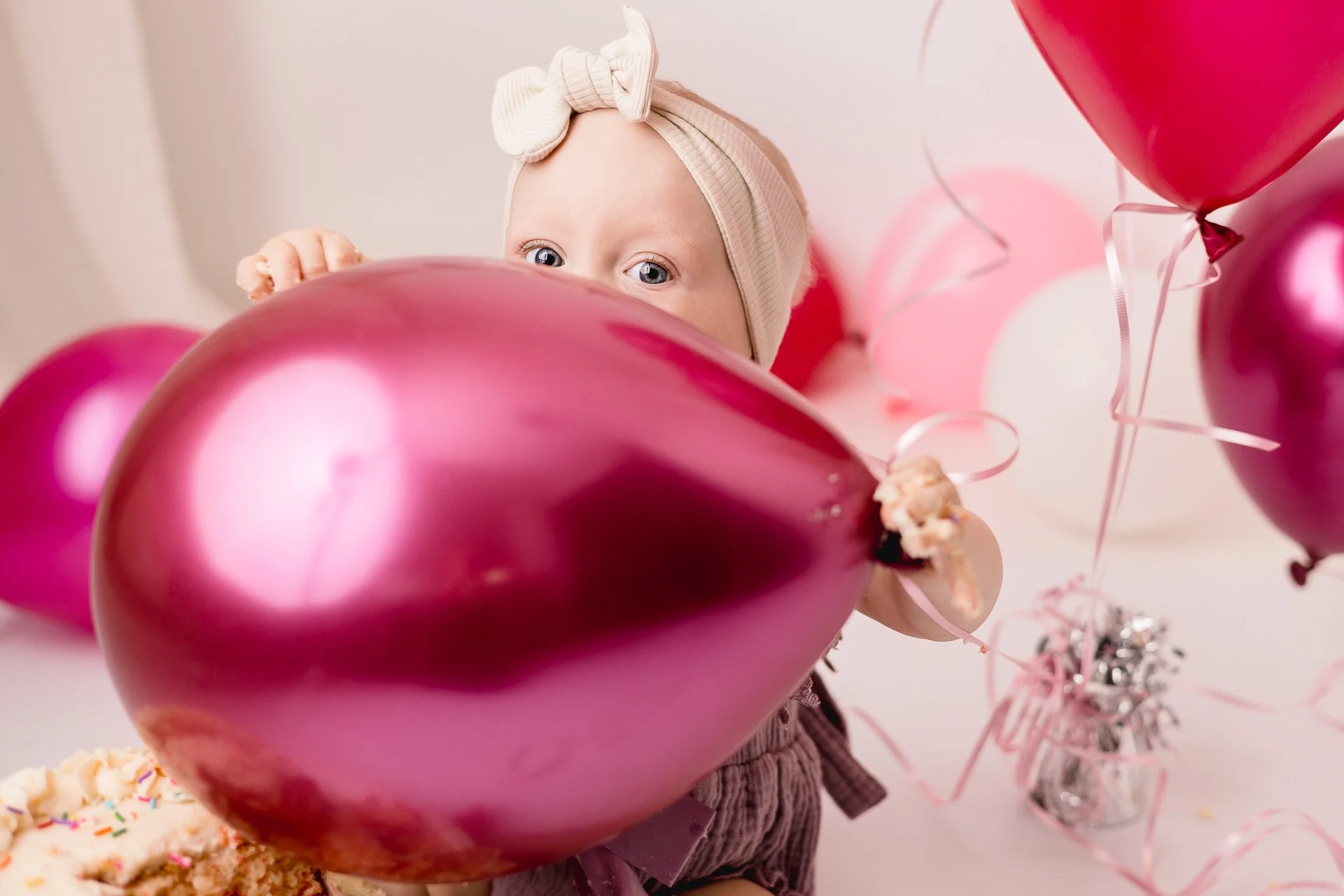 Big red balloon for little girls birthday cake smash session SophiePhoto in Victoria BC