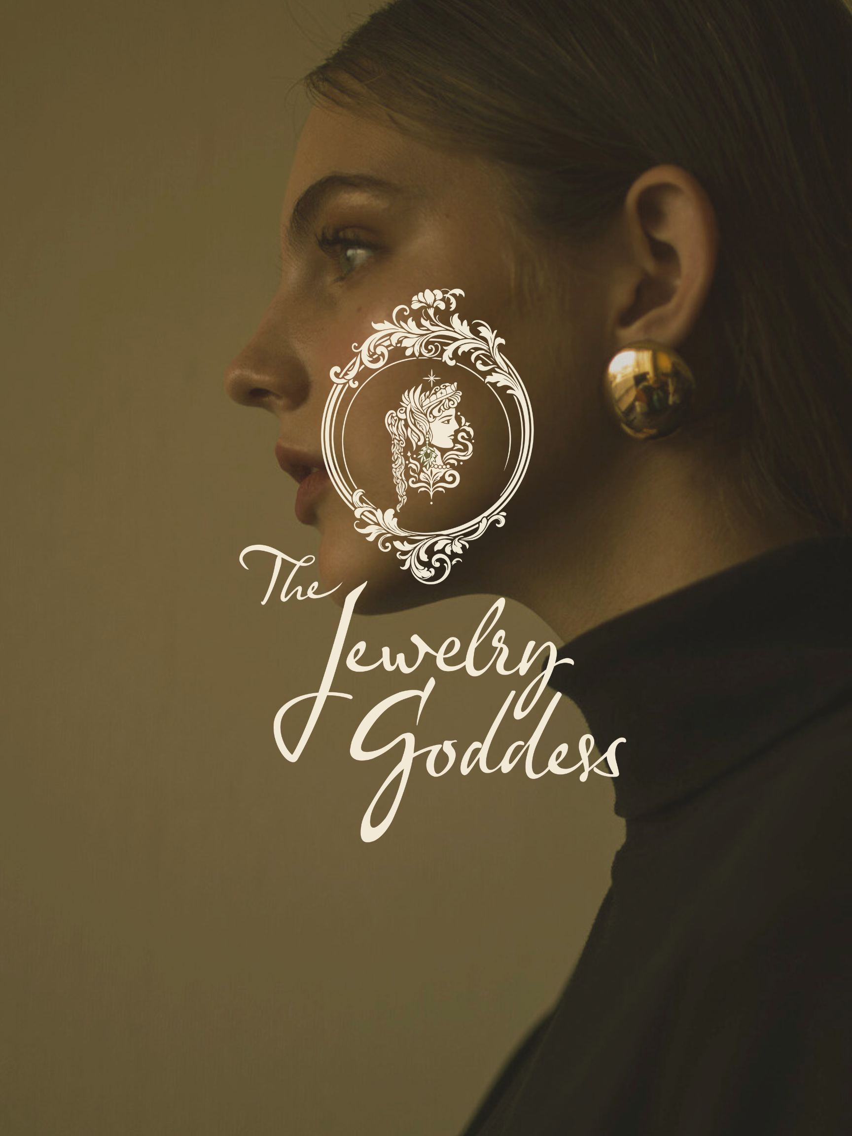 Side profile of a woman with dark hair styled back, wearing large gold earring, with overlay text 'The Jewelry Goddess' and a decorative logo of a woman's head with flowing hair and accessories.