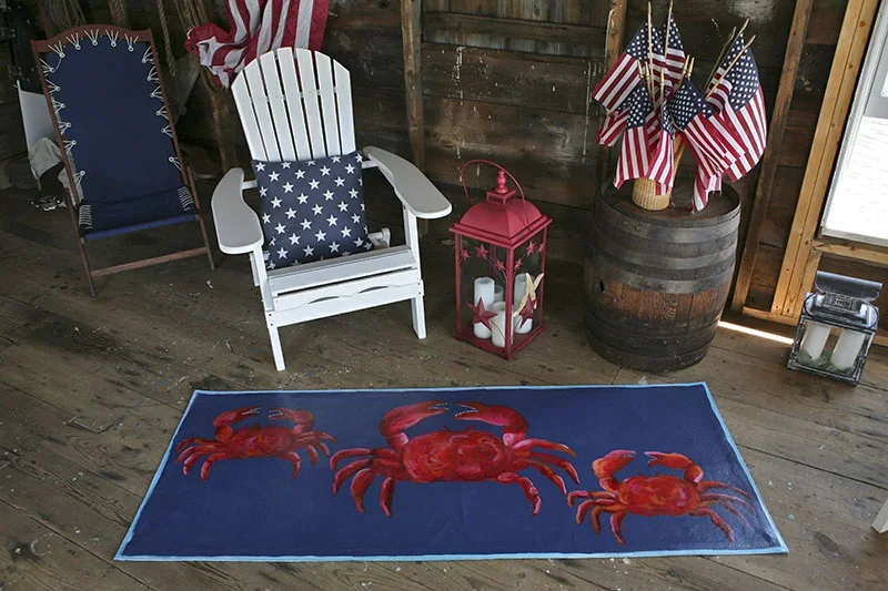 Boat house with hand-painted canvas runner of red crabs on dark blue background