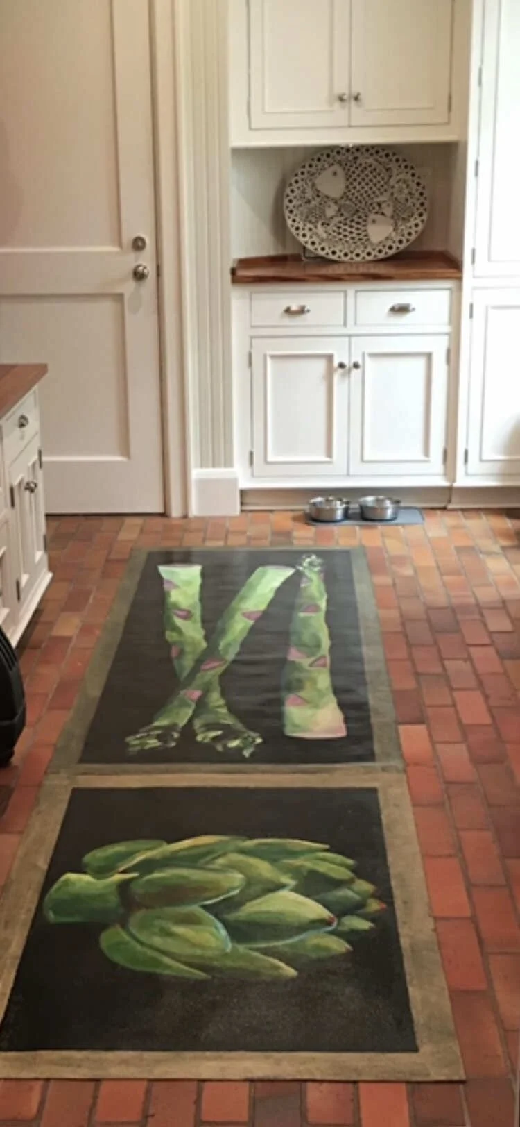 Kitchen with hand-painted canvas runner of asparagus on black background and floorcloth of artichoke on black background