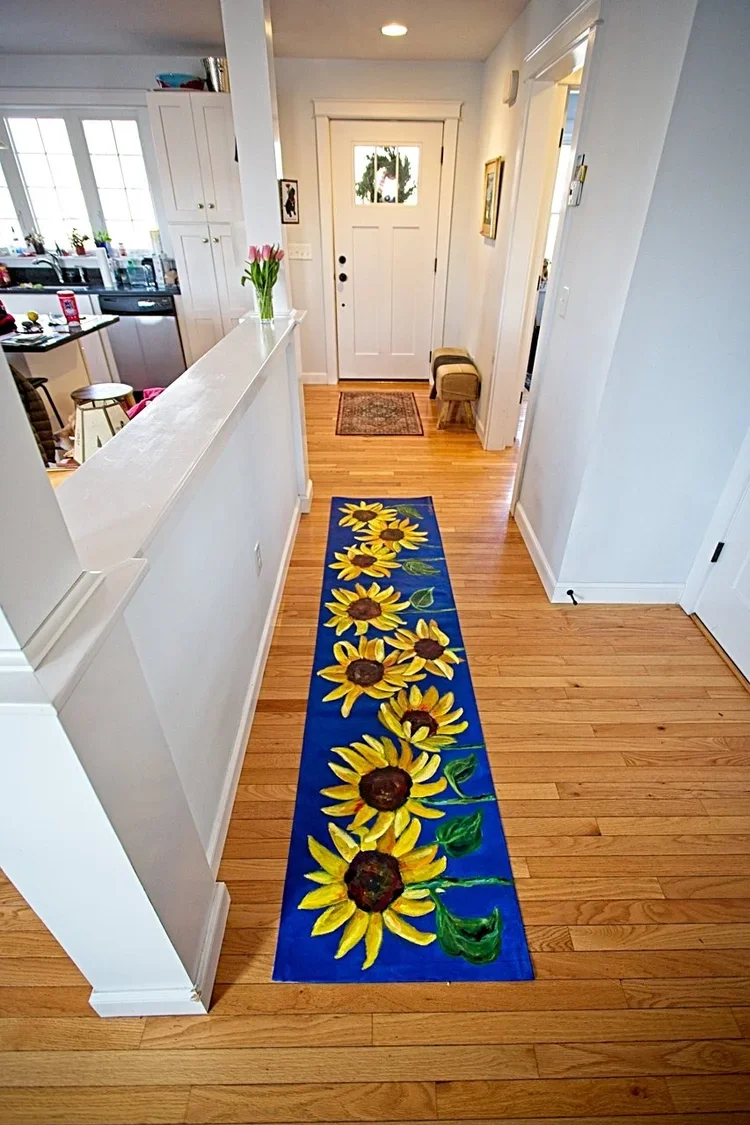 Hallway with custom hand-painted canvas runner of daisies on blue background