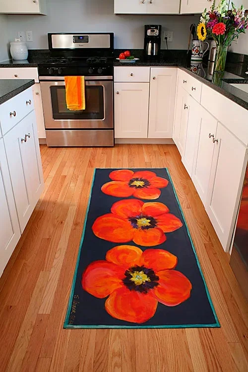 Kitchen with hand-painted canvas runner of orange poppies on navy background