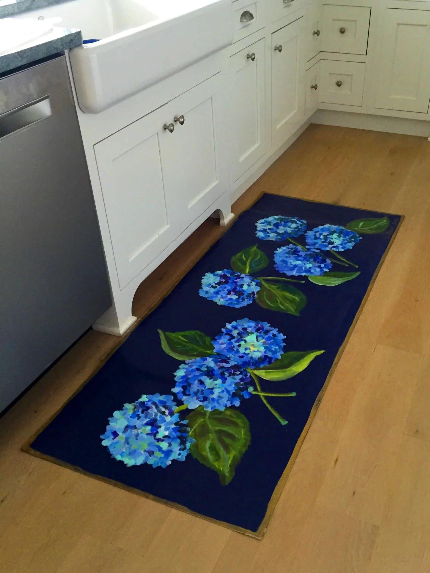 Kitchen with hand-painted canvas runner of blue hydrangeas on black background
