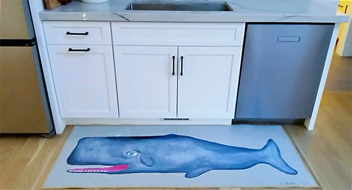 Kitchen with hand-painted canvas runner of light blue whale on gray background