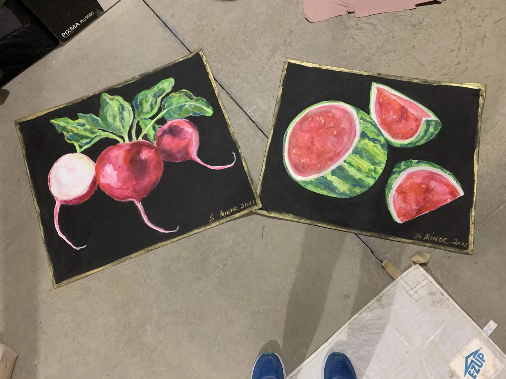 Two hand-painted canvas floorcloths, one of watermelons  on black background and one of radishes on black background