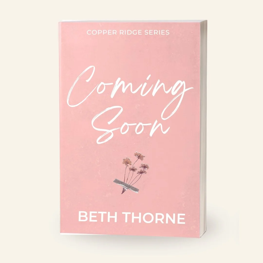 Pink book cover titled 'Coming Soon' by Beth Thorne, part of Copper Ridge series, with a small illustration of a few flowers taped with a piece of gray tape.