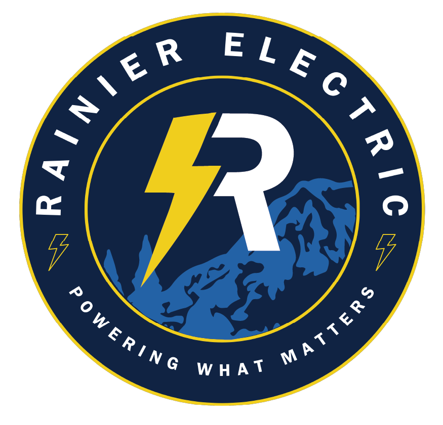 Logo for an electric utility company featuring a yellow lightning bolt crossing a white 'R' and mountain scenery in blue, with the words 'Rainer Electric' and the slogan 'Powering What Matters'.