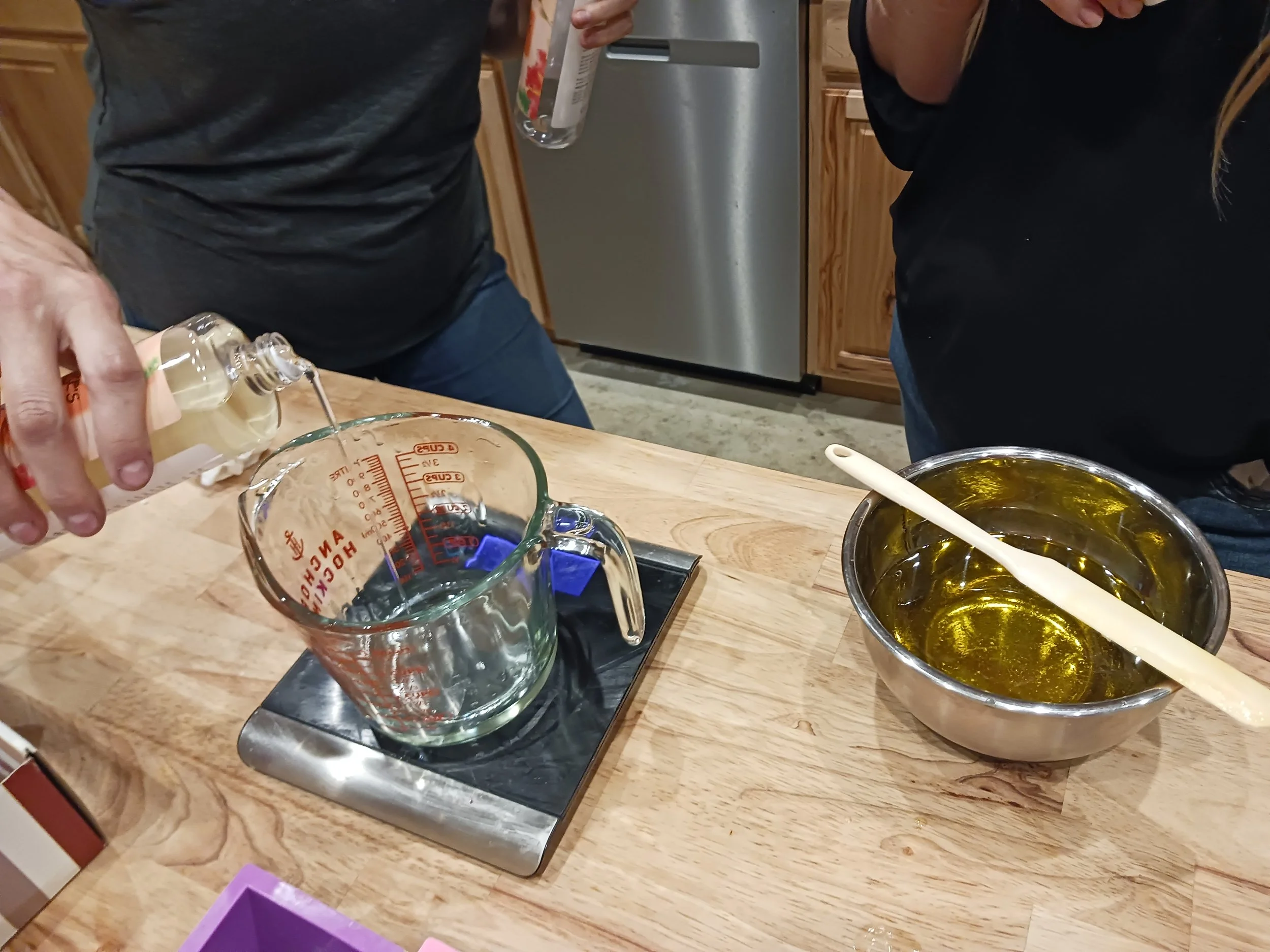 Women making homemade salve together.