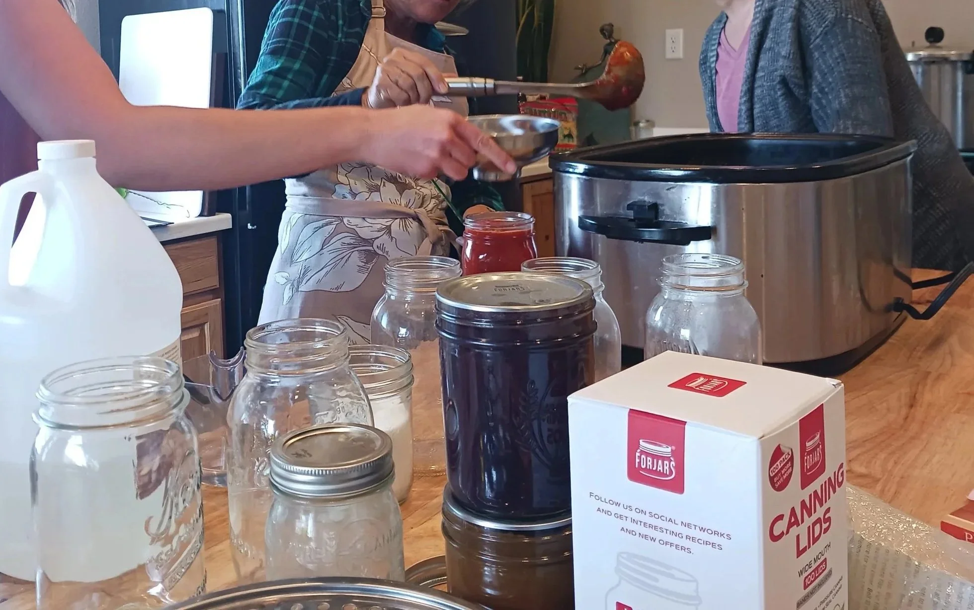 Women canning together.