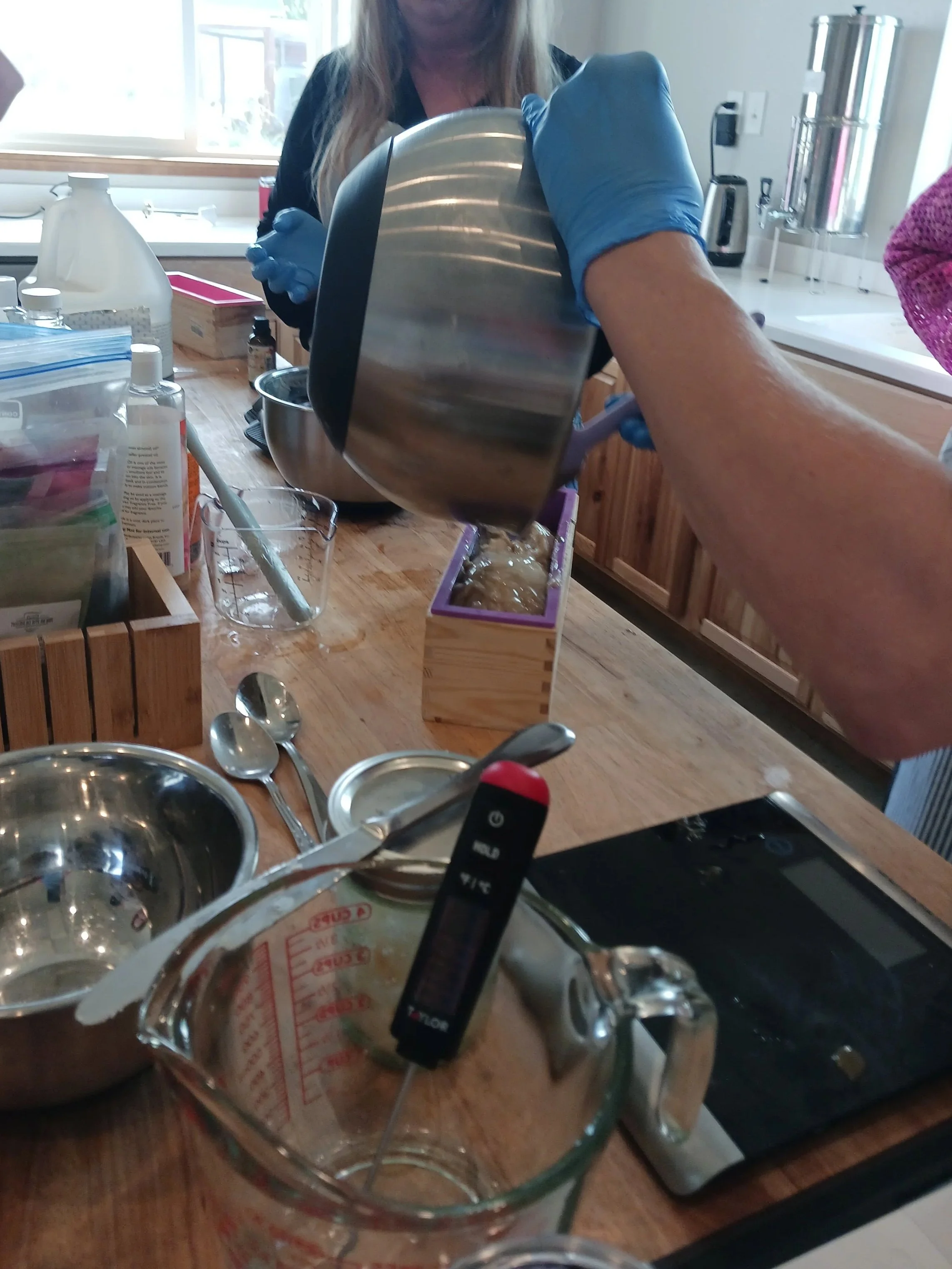 Women making soap together.