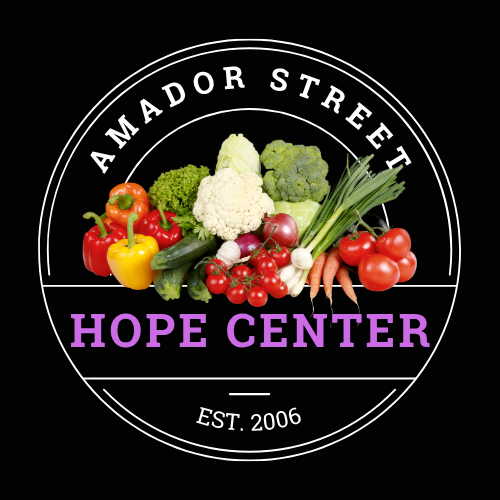 A circular logo with the text 'Amador Street Hope Center Est. 2006' and an image of fresh vegetables including bell peppers, cauliflower, broccoli, carrots, cherry tomatoes, and green onions.