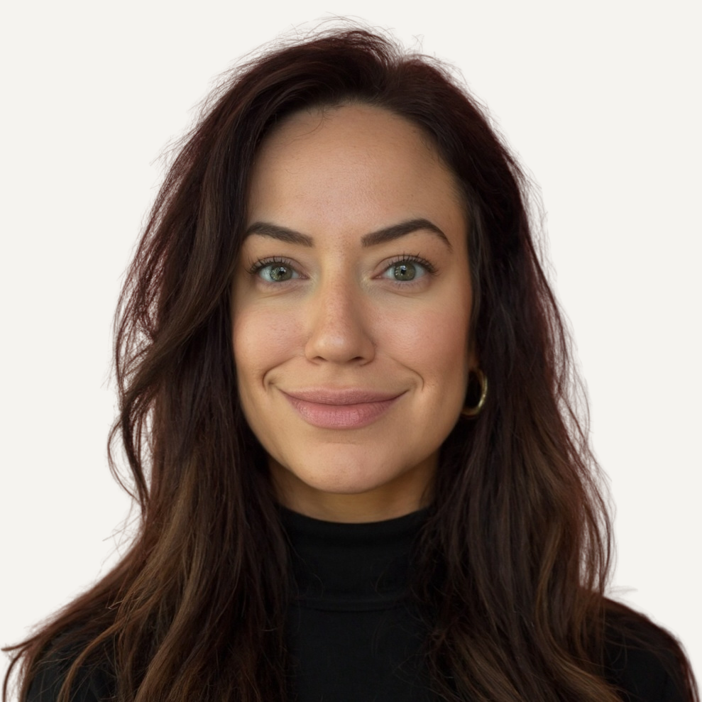 Sarah Scherzer, graduate counseling intern, wearing a black turtleneck against a white background.