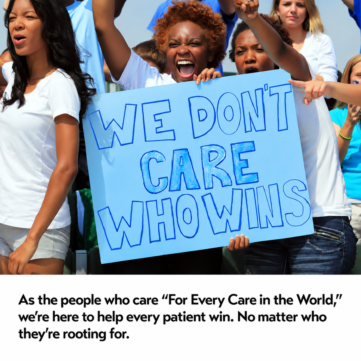 Fans holding sign at college football game.