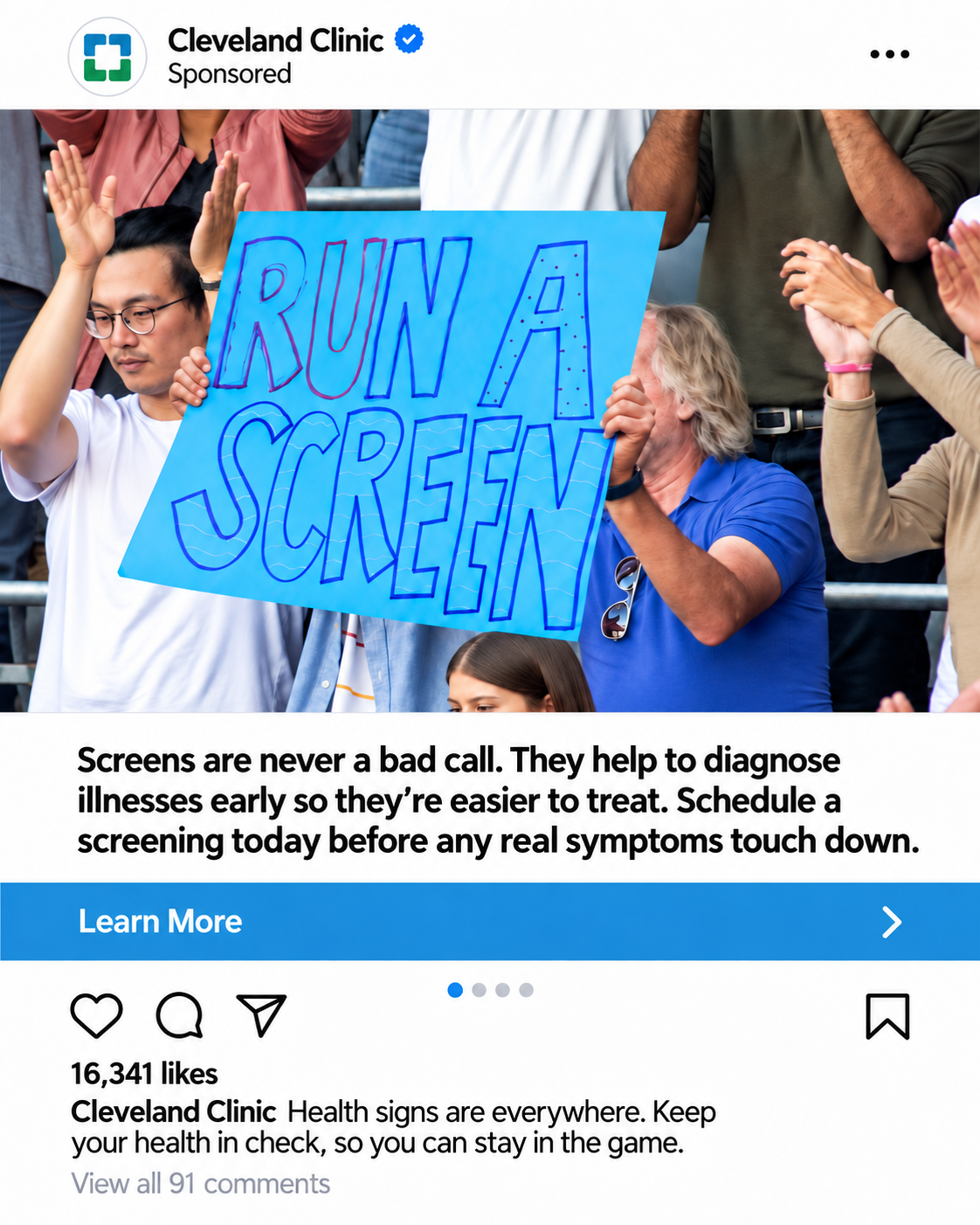 Fans holding "Run A Screen" sign at college football game.