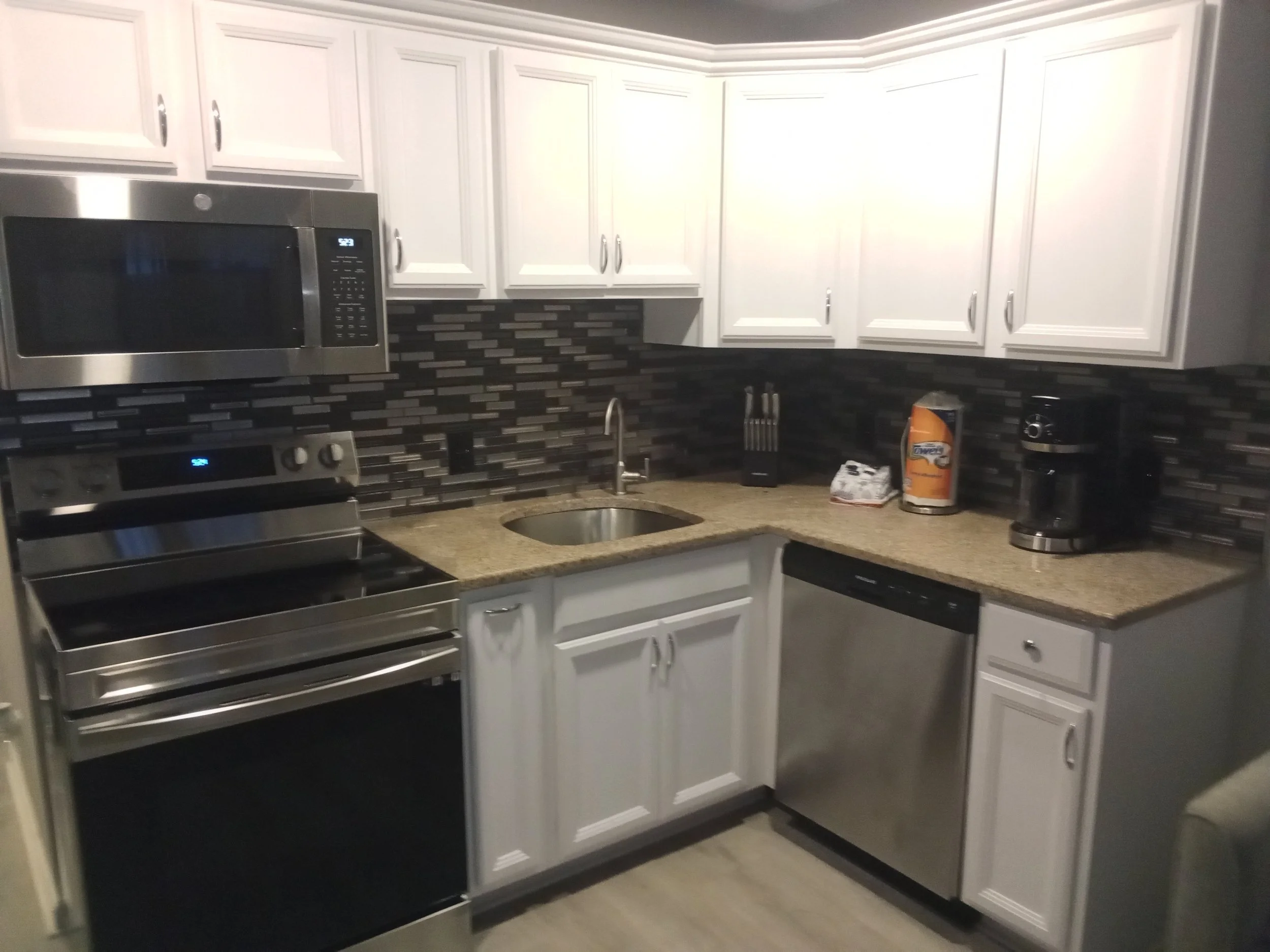 New Appliances and backsplash to update white cabinets