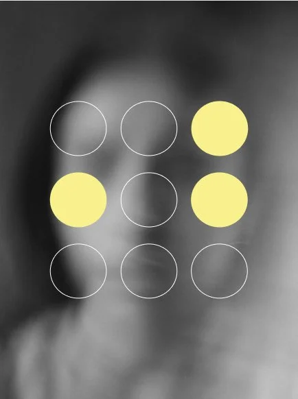 A blurred grayscale image of a person with six yellow circles and six white outline circles overlayed, arranged in a grid pattern.