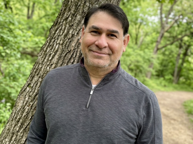Louis Martinez in a rare pose for the camera, especially on a hiking trail with bugs.