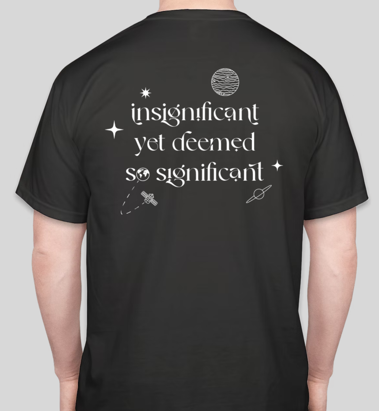 Black t-shirt with white space-themed graphics and the quote, "insignificant yet deemed so significant."