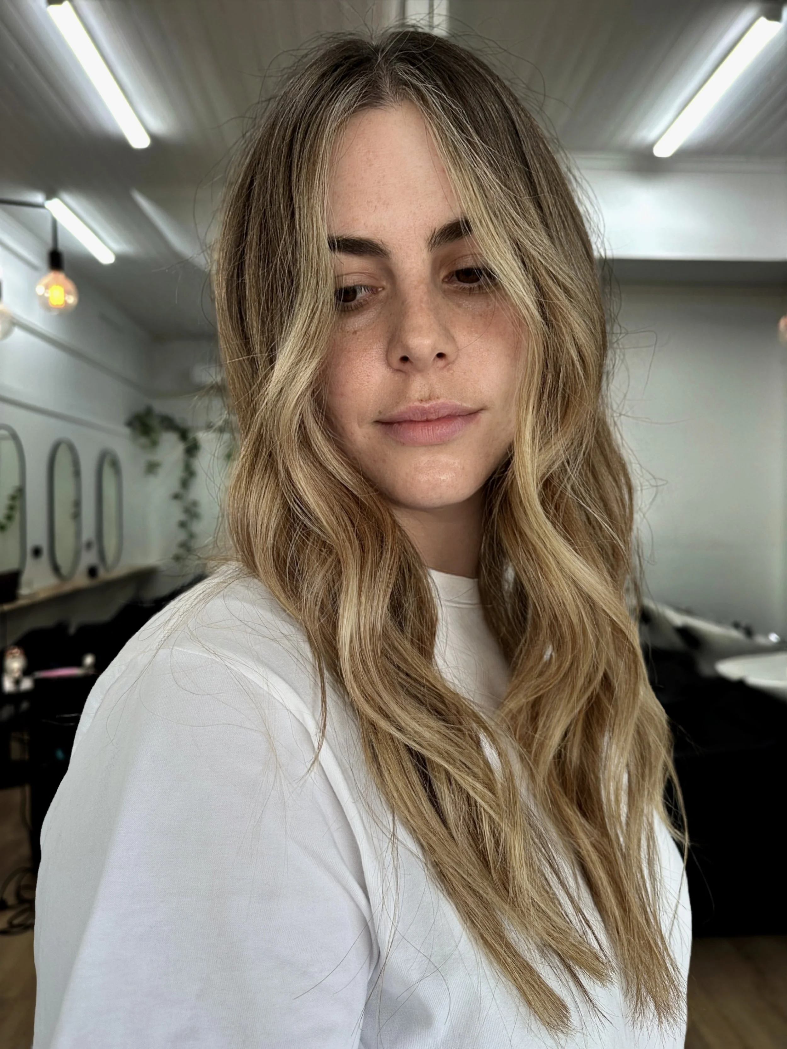 Soft dimensional blonde with natural depth and bright face framing pieces by Kara's Hair Chair Belmont NSW. Low maintenance colour expert for Newcastle and Lake Macquarie.