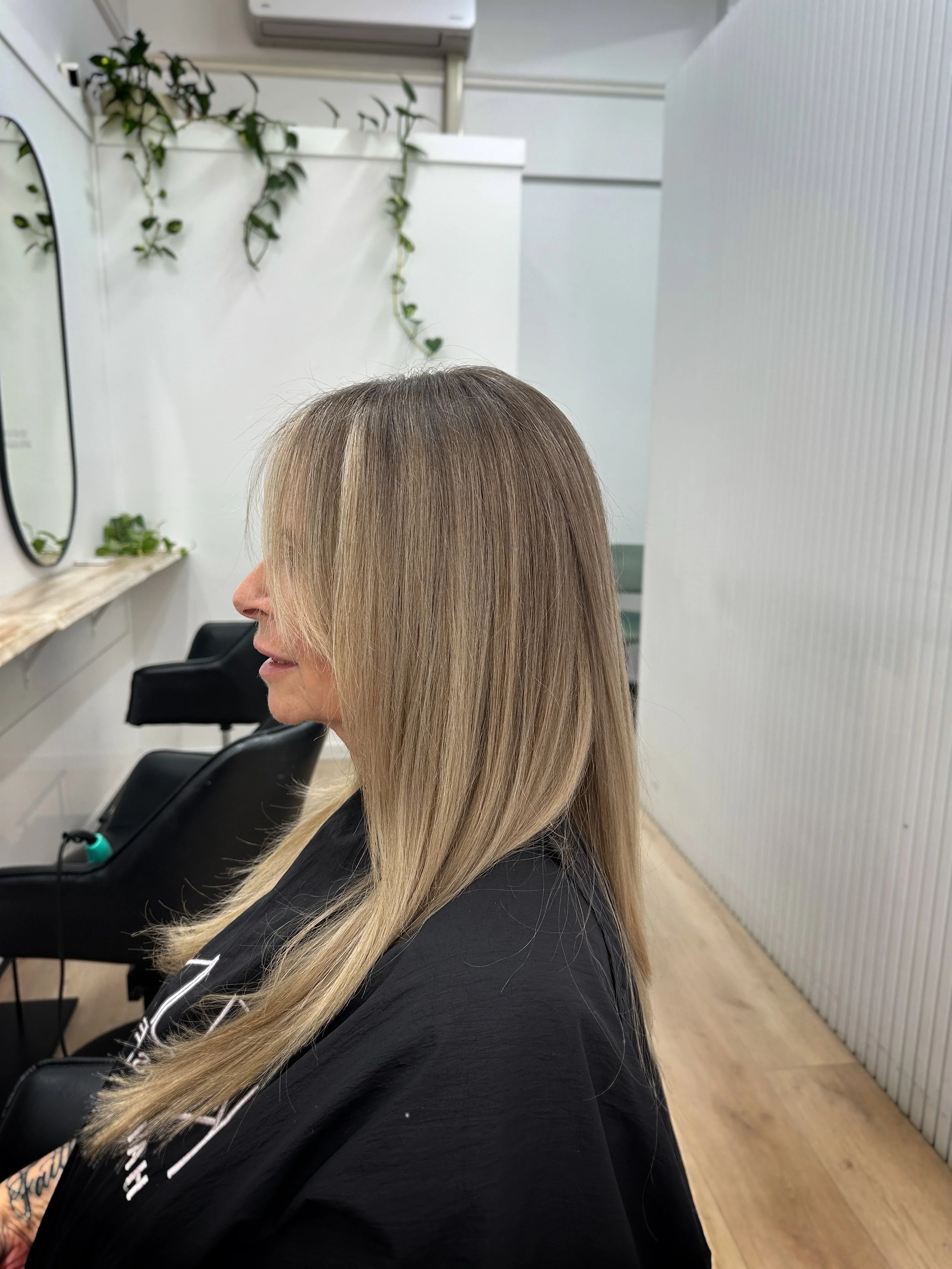 Lived in and grey blending into a creamy blonde. Finished hair smooth a sleek by Kara's Hair Chair blonde expert in Belmont NSW and Lake Macquarie. 