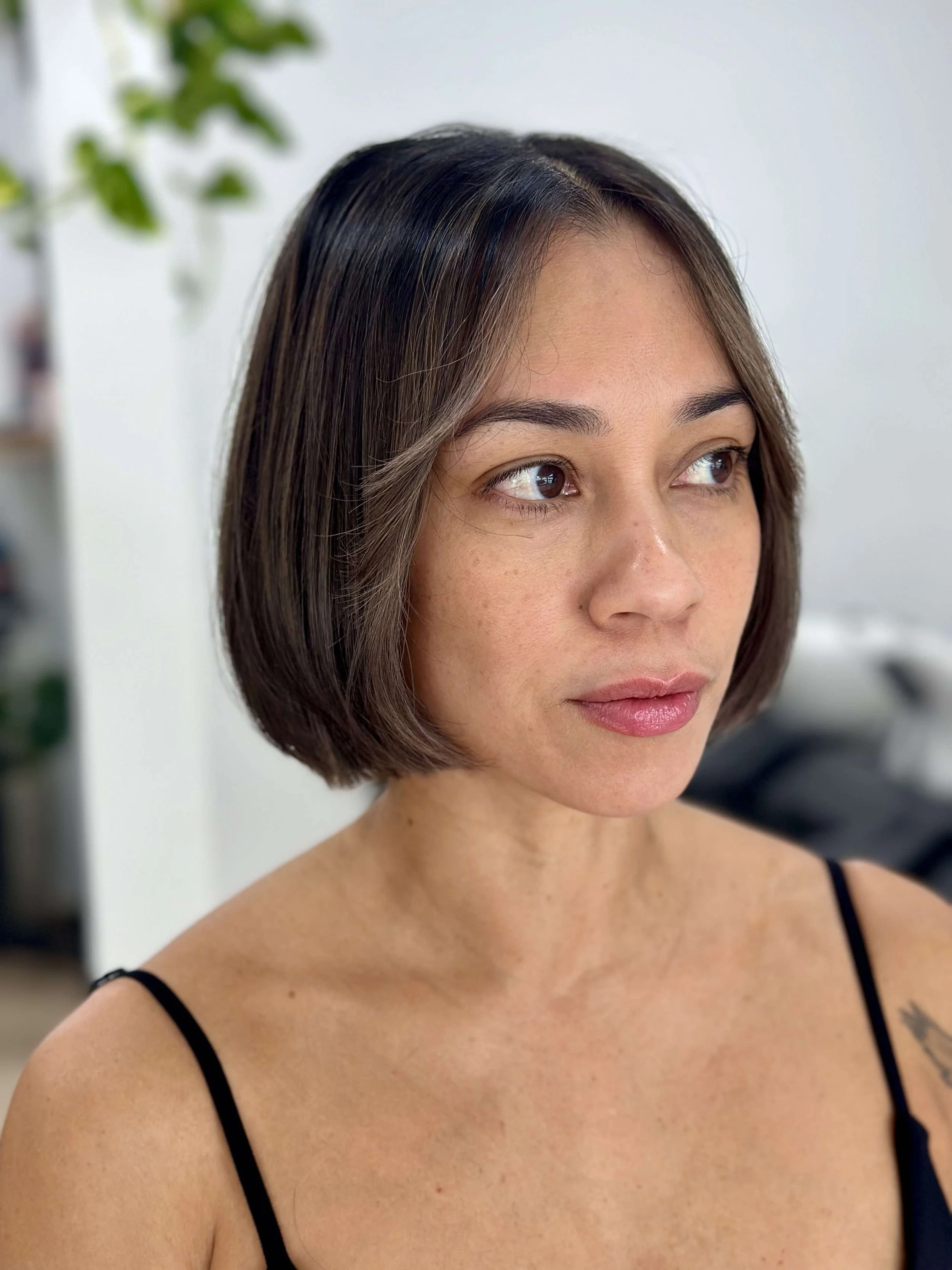 Rich dimensional brunette hair colour and sharp bob haircut by Kara's Hair Chair a hairdresser in Belmont NSW serving clients from Newcastle and Lake Macquarie.