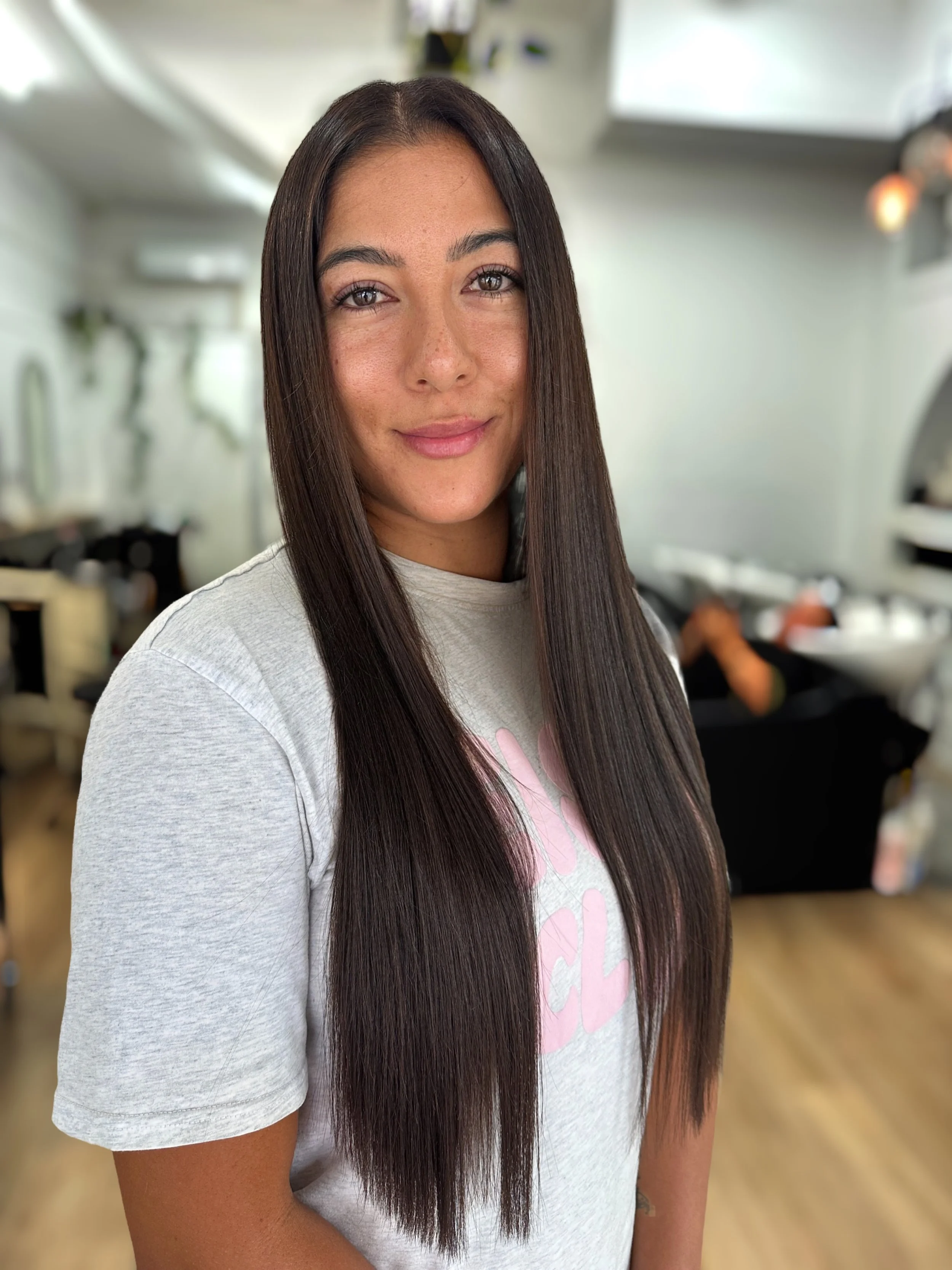 Glossy rich brunette hair colour by Kara's Hair Chair, a hairdresser in Belmont NSW serving Newcastle and Lake Macquarie.