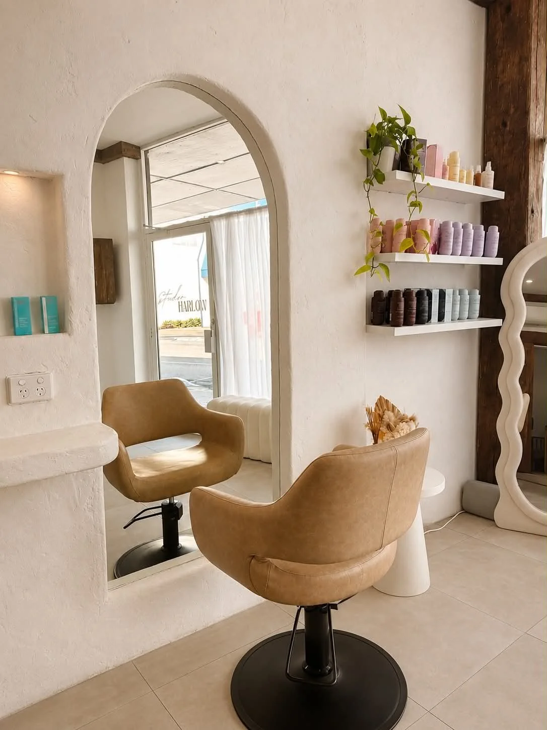 Interior of Kara's Hair Chair, a boutique hair salon inside of Studio Harlow in Belmont NSW, with styling chairs, mirrors, professional products and natural light.