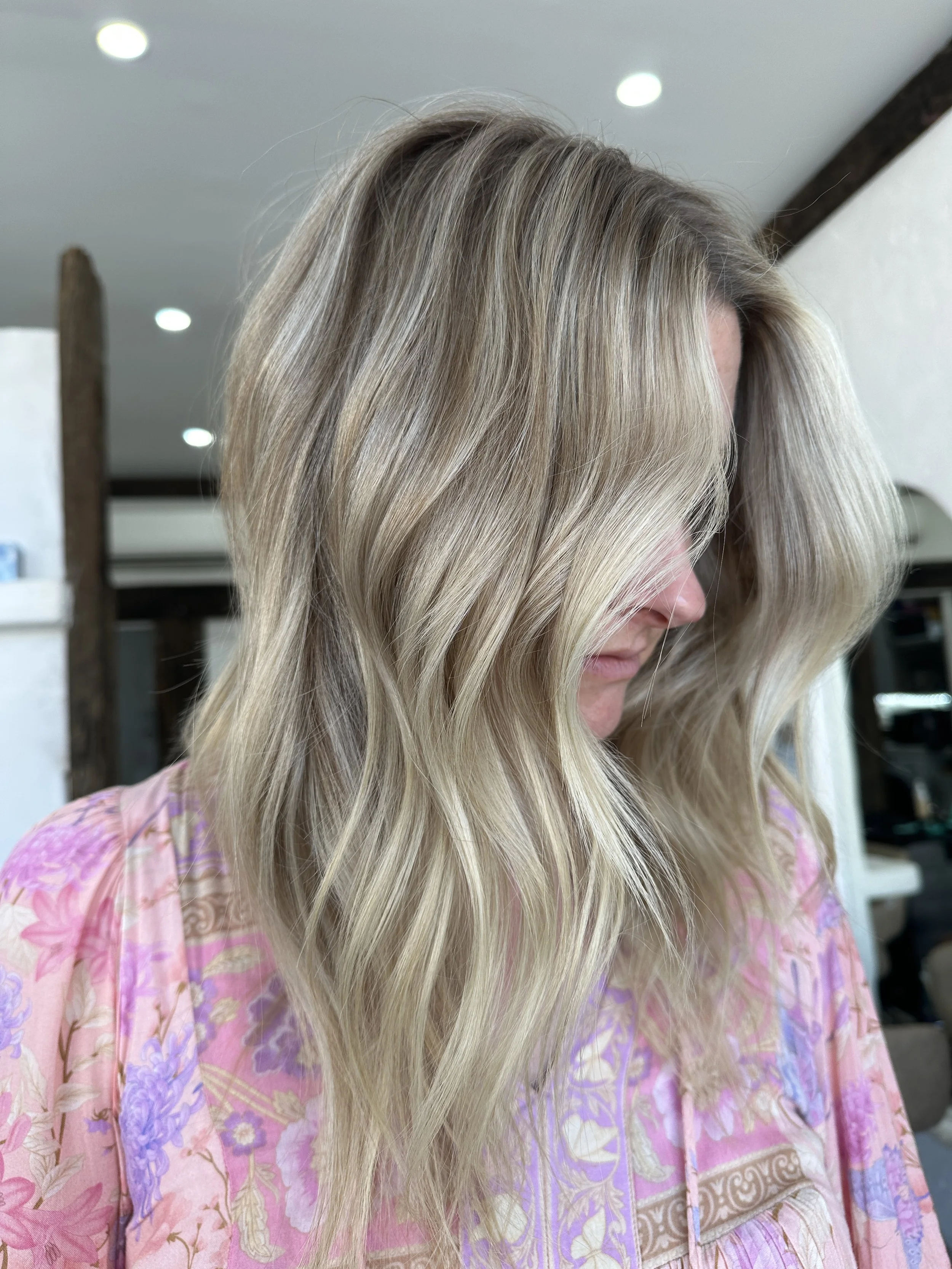 Long dimensional blonde with soft waves and a bright natural finish by Kara's Hair Chair, Belmont hairdresser serving Newcastle and Lake Macquarie.