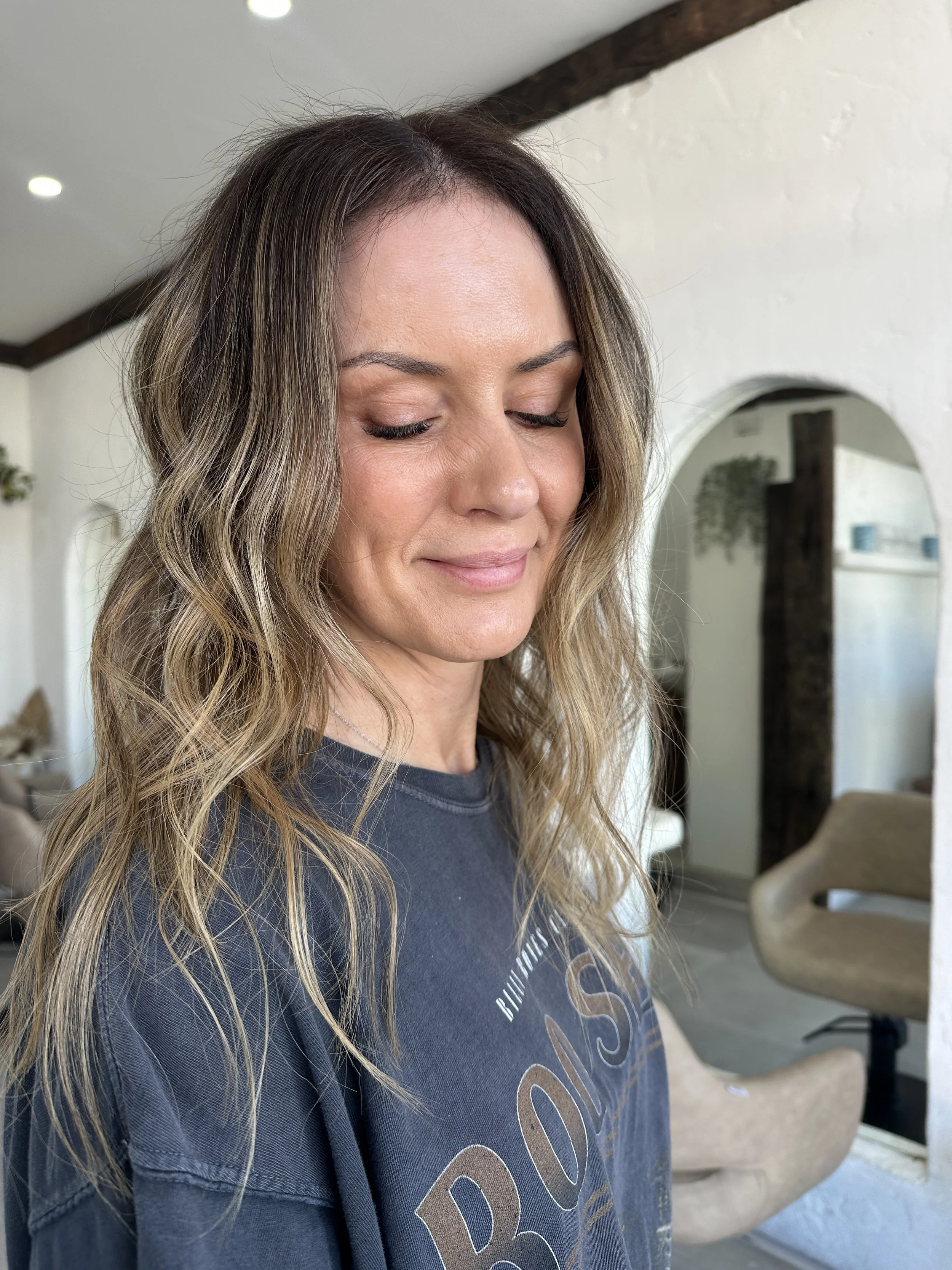 Dimensional bronde with soft blonde highlights and natural depth by Kara's Hair Chair Belmont.
