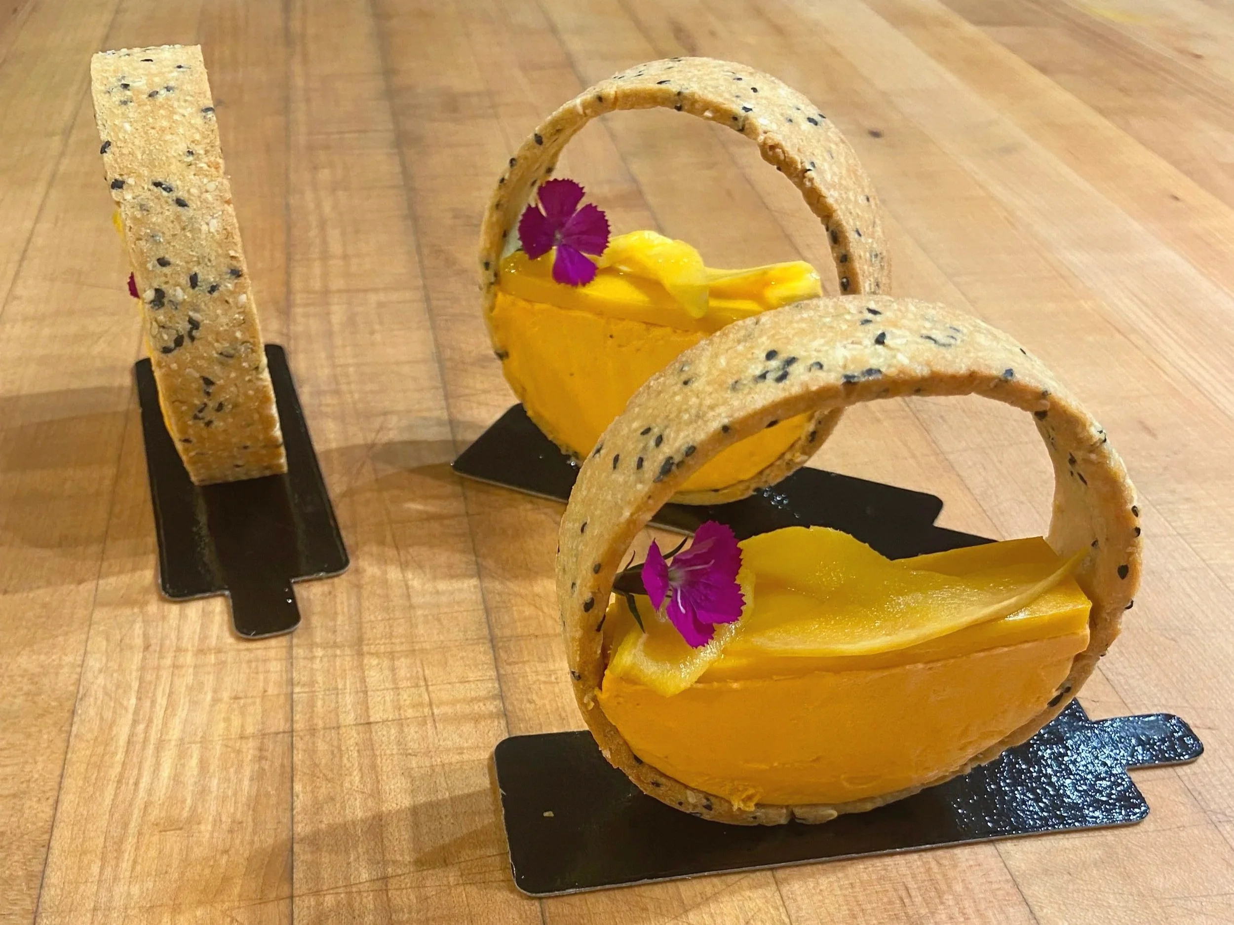thai tea, black sesame and mango vertical tart