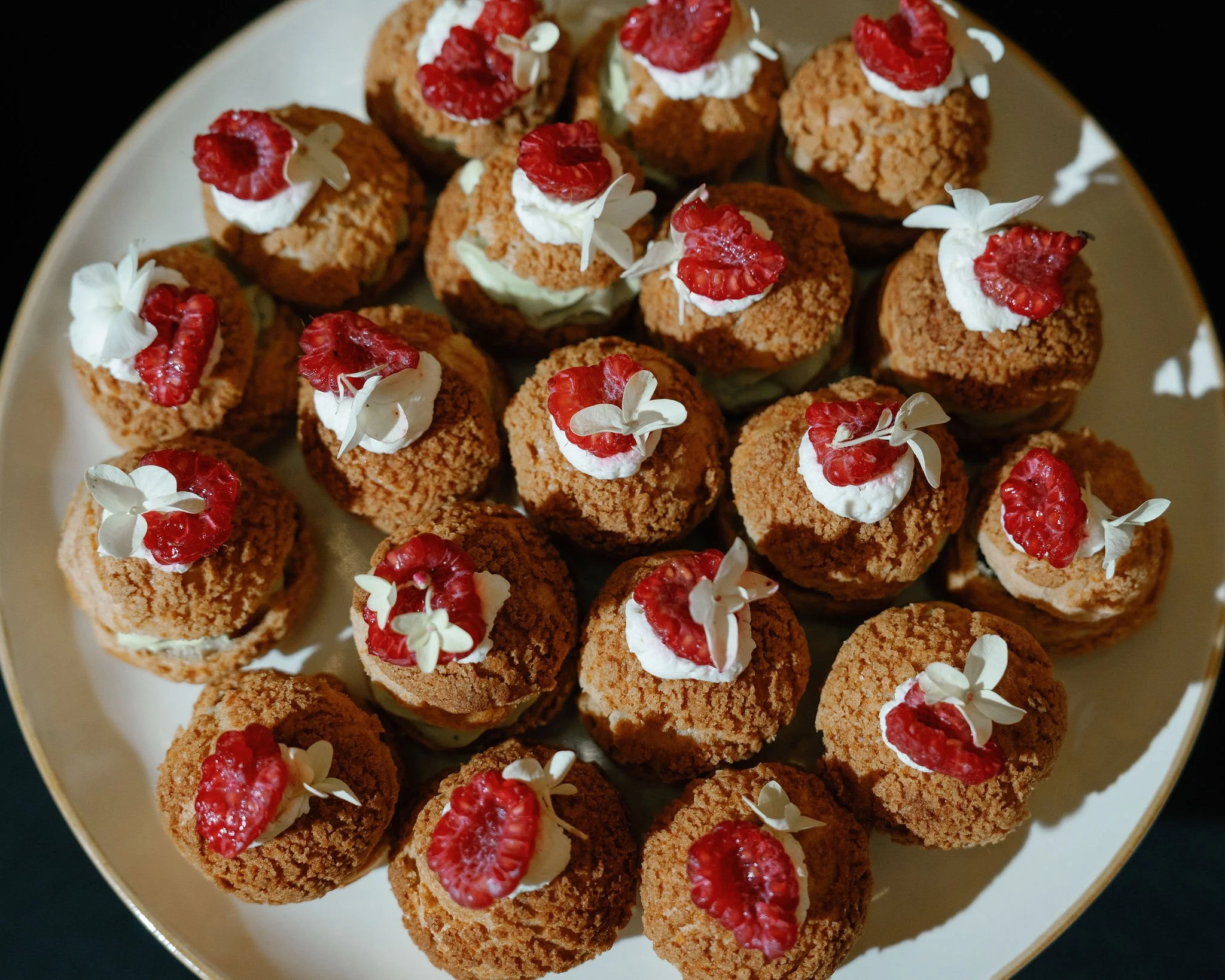 raspberry pistachio profiteroles for a wedding