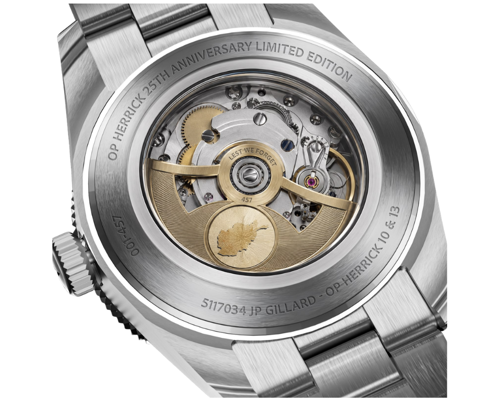 Close-up of the back of a luxury wristwatch with the inner mechanical movement visible through a transparent case back, engraved with 'OP HERRICK 25TH ANNIVERSARY LIMITED EDITION' and other details.