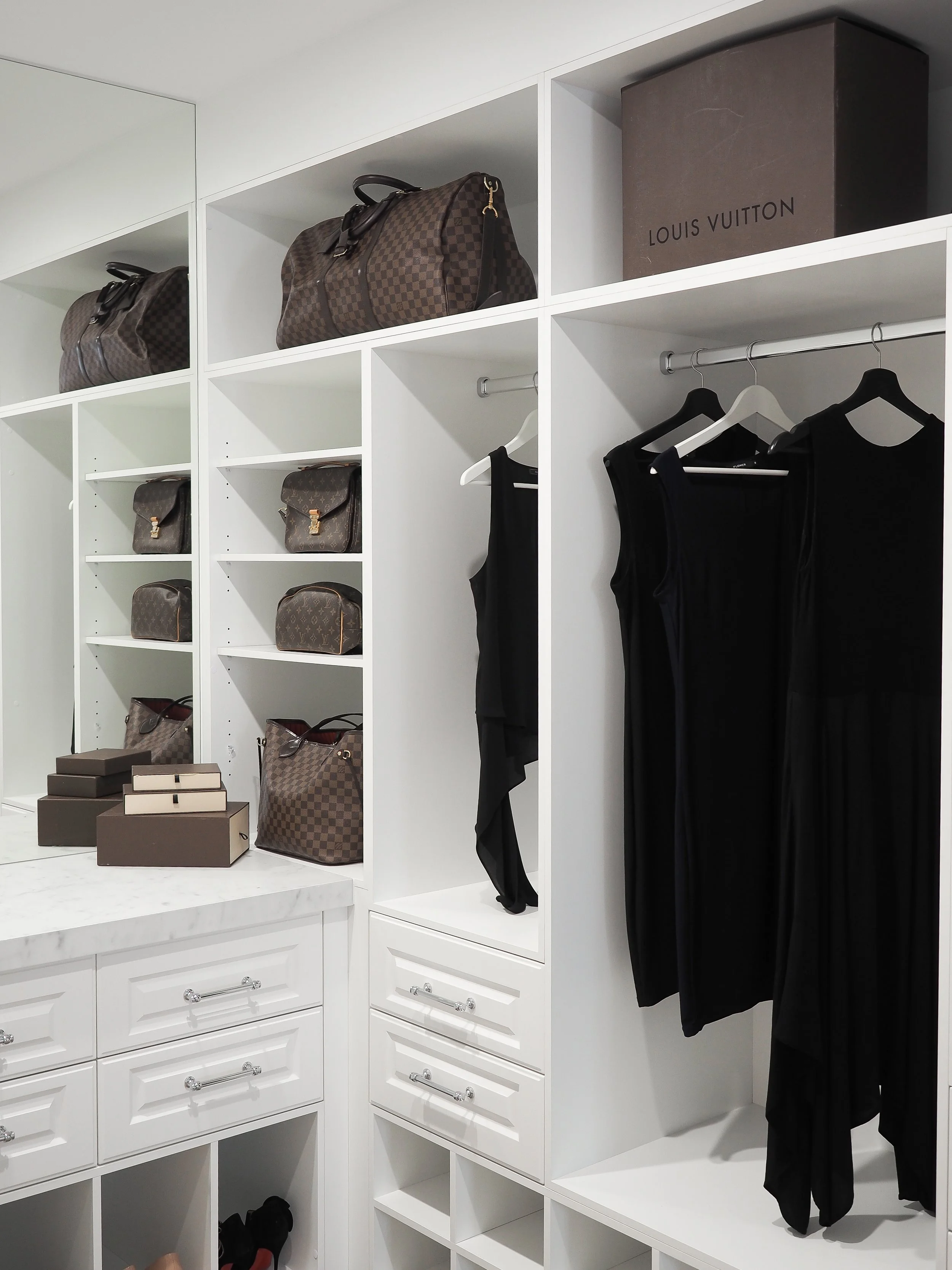 This custom walk-in wardrobe designed and built by Utopia Kitchens + Living showcases what bespoke storage looks like when every detail is considered. The cabinetry is finished in a crisp satin white with profiled drawer fronts and crystal-clear knob