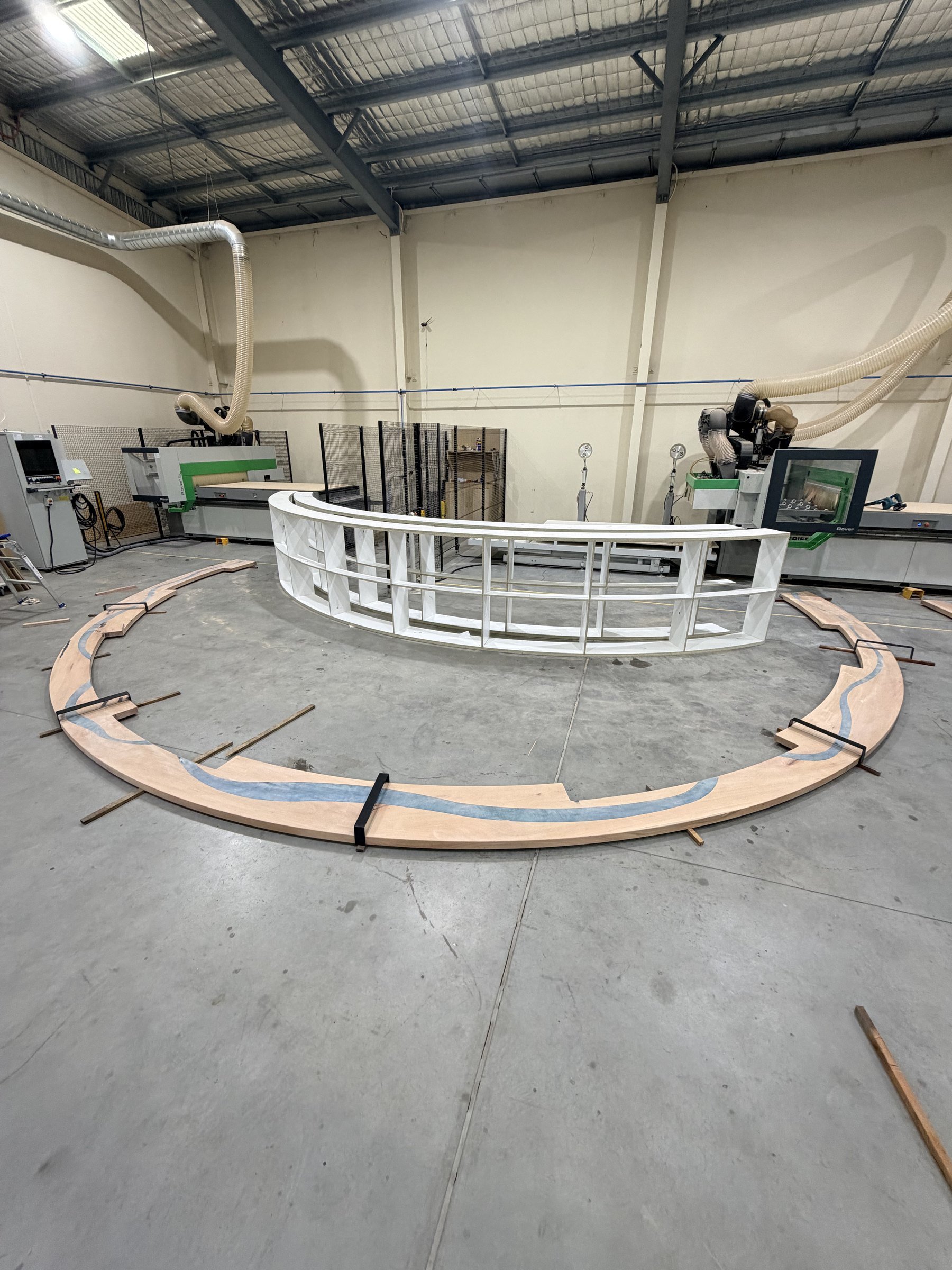 Step 8: the completed bartop sections laid out as a full ring on the workshop floor for a final check before the install.