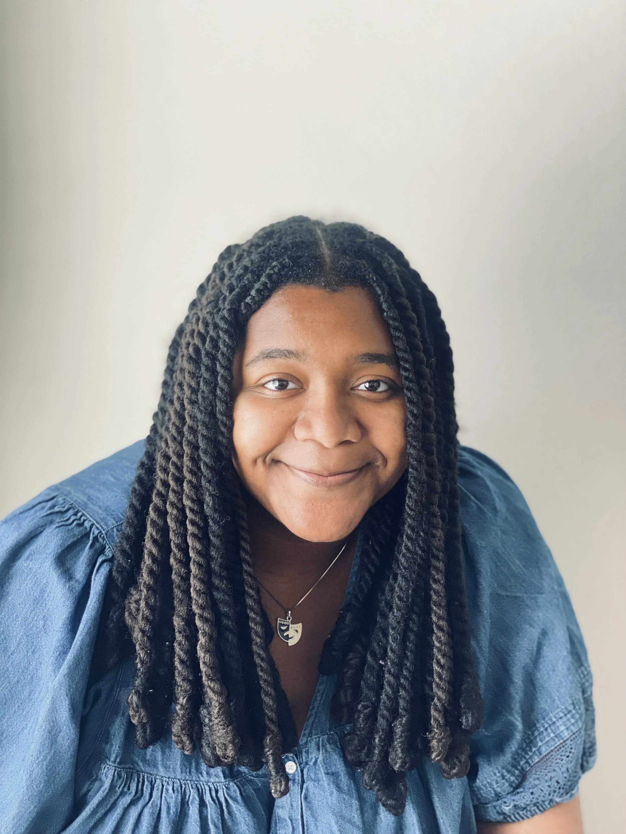 Close up portrait of Trinity Perry smiling.