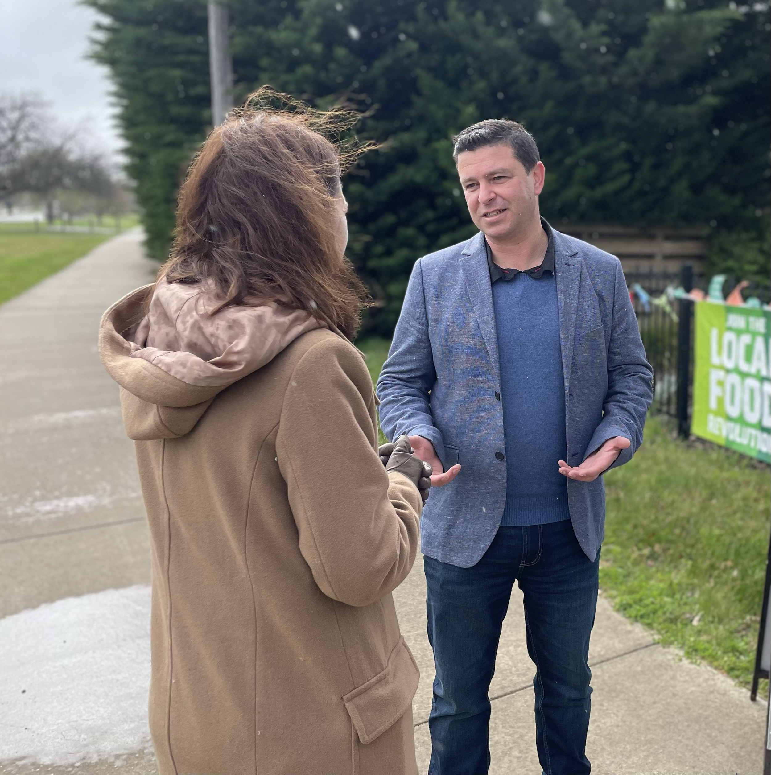 Dom Bonanno speaking with local community members