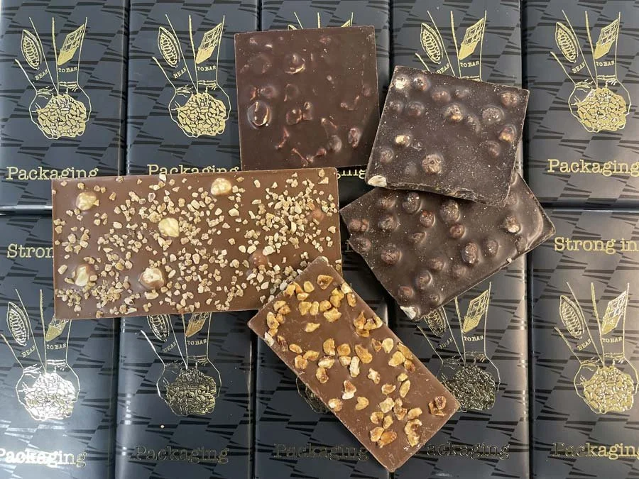How do you keep nut toppings on chocolate bars fresh?
