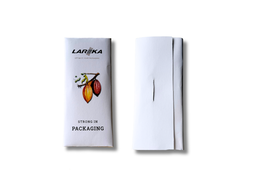 A chocolate bar wrapped in a white pouch packaging style box with the label 'LAREKA OPTIMIZE YOUR PACKAGING' and an illustration of cacao pods, along with the text 'STRONG IN PACKAGING'. 