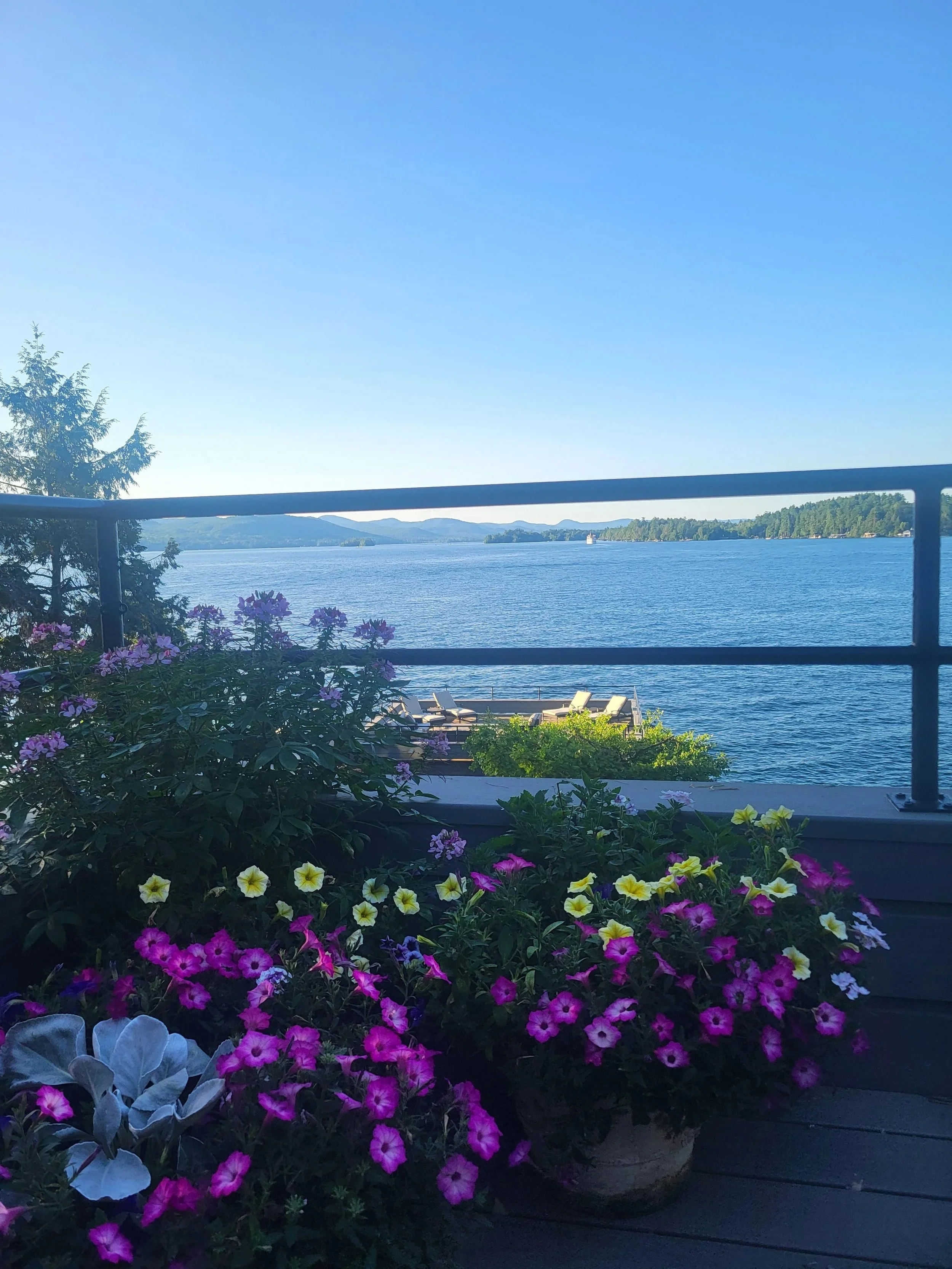 Lake View Deck with Flowers Concierge Lake George