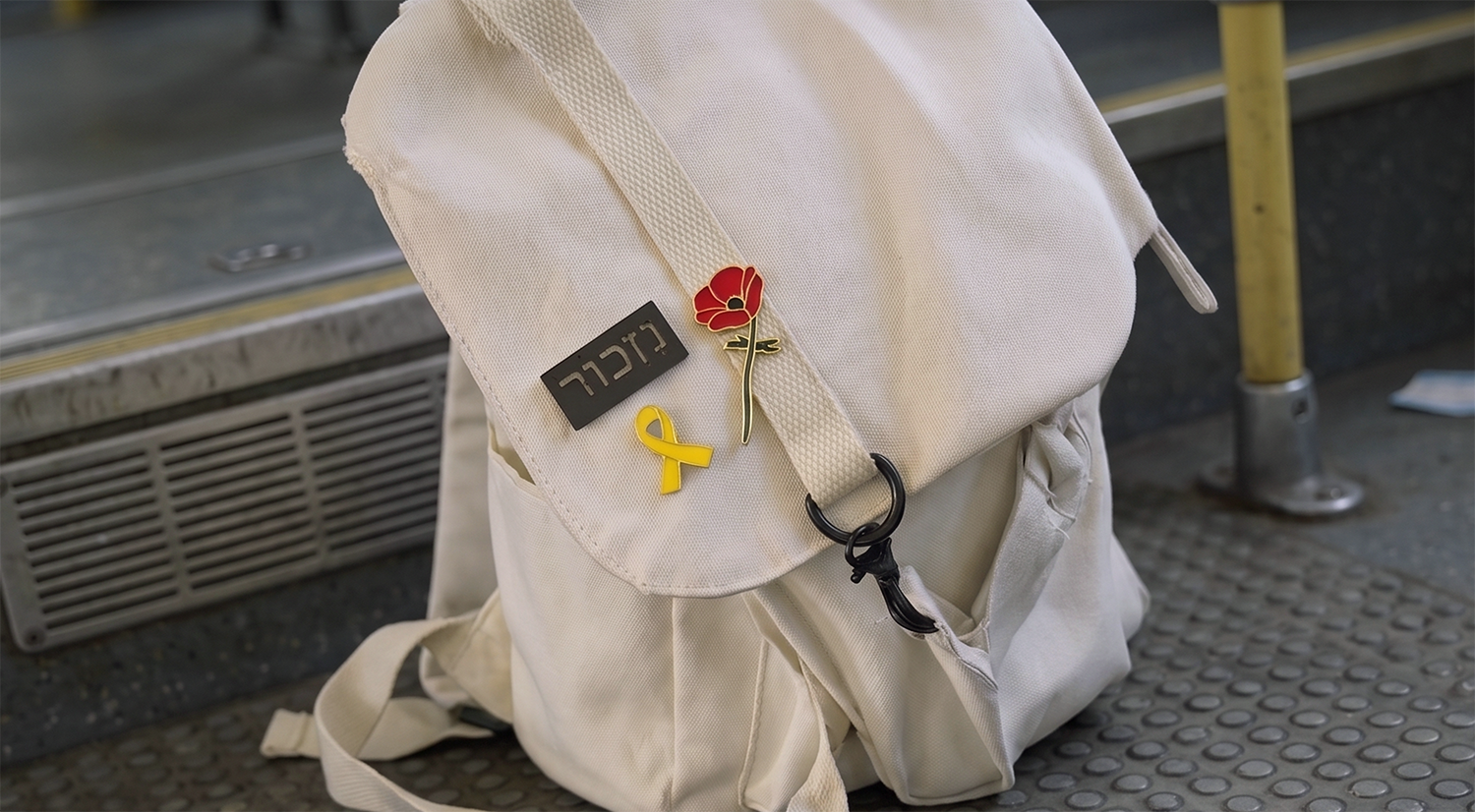 1st fold gif_small_pin on white bag.png