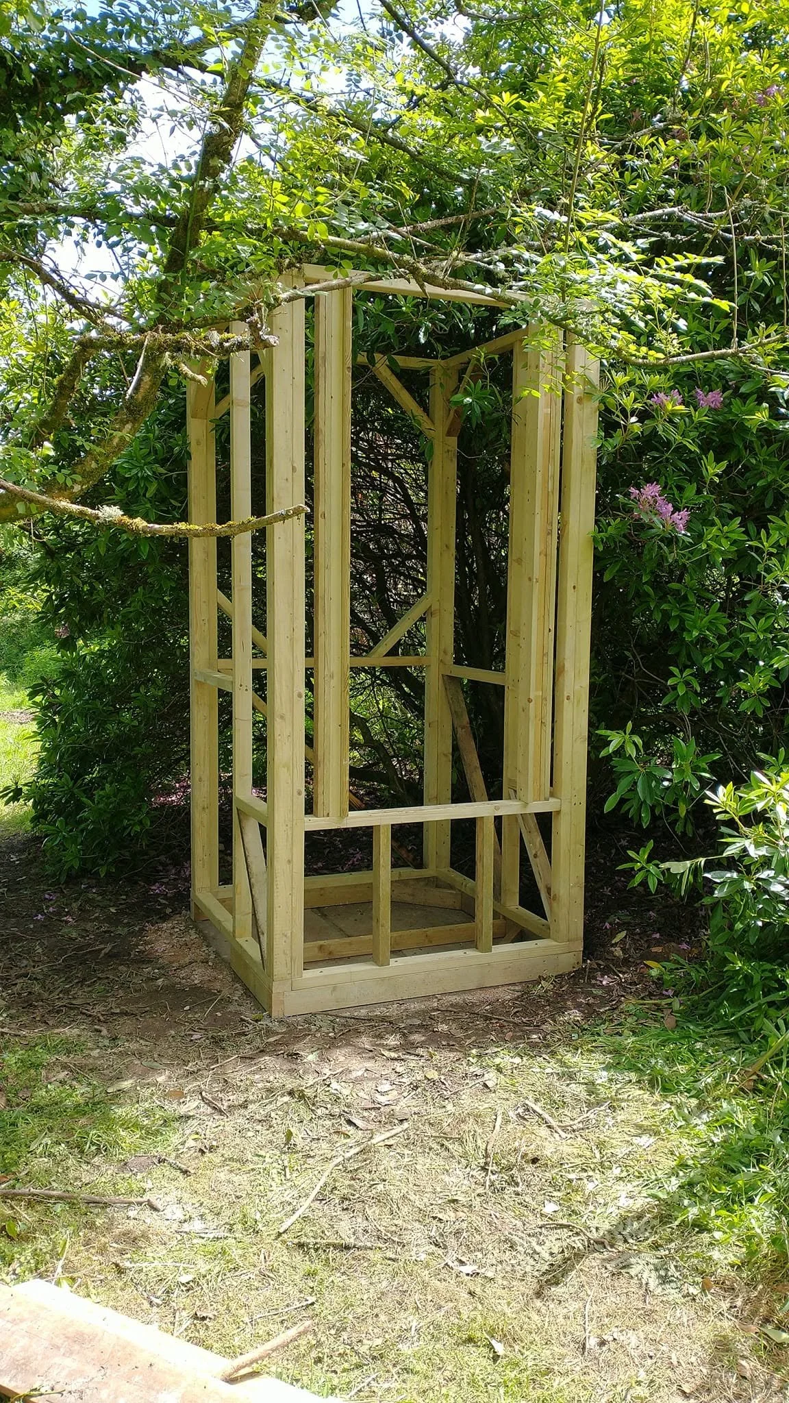 Timber frame of a compact garden composting toilet during construction.