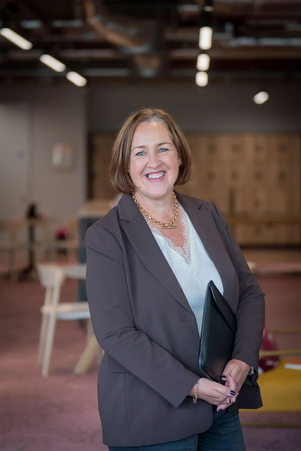 SaaS recruitment specialist in office holding file