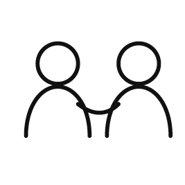 To personer i dialog – symbol på samarbejde, relationer og fælles udvikling.