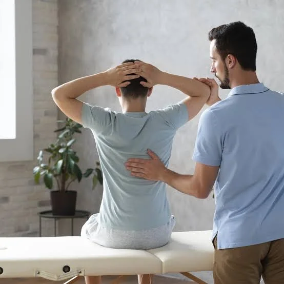 Physical therapy session with a patient stretching and a therapist guiding and supporting