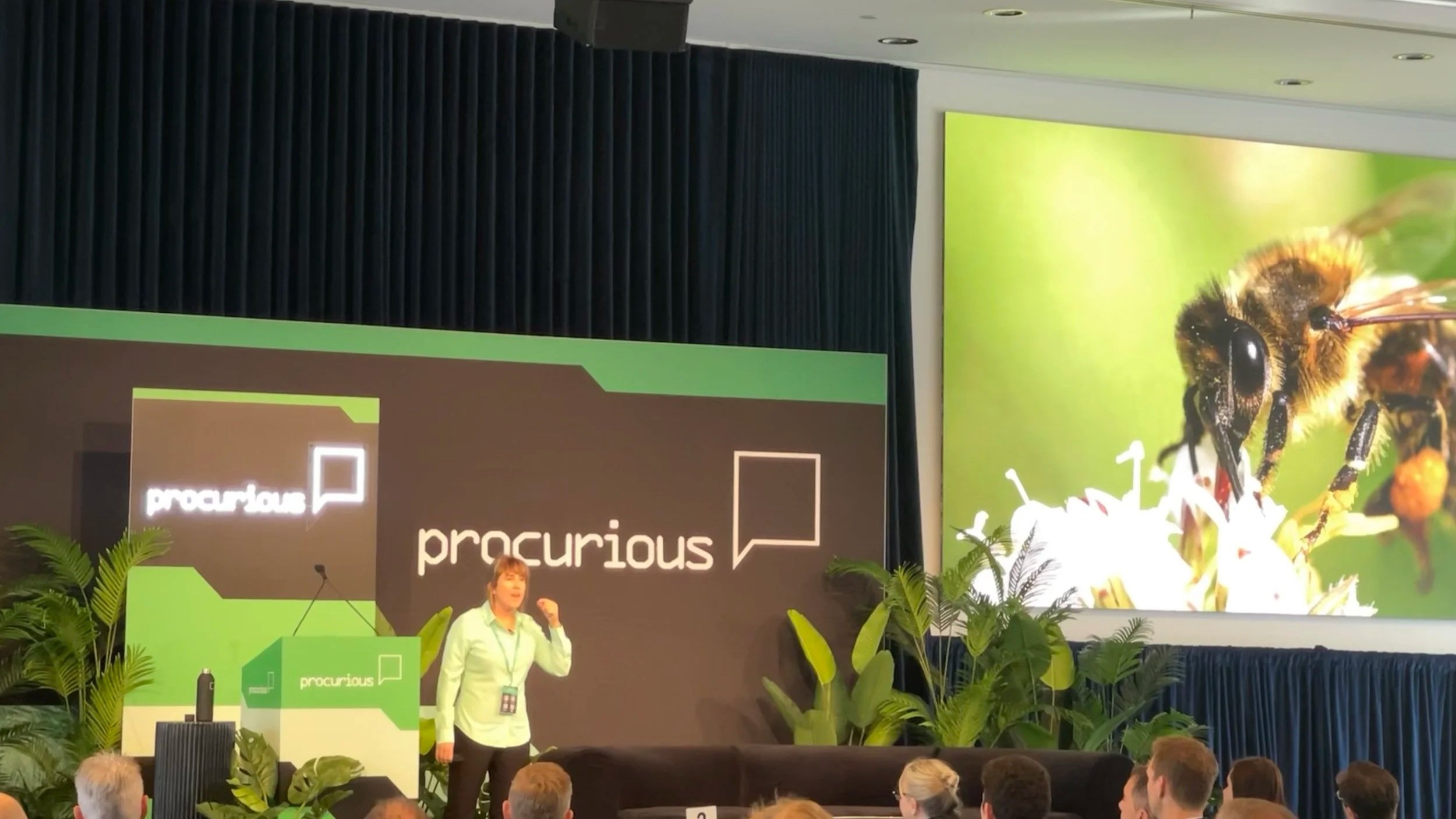 Pia Williams speaking on biomimicry innovation at a Procurious conference keynote, Feral by Design.