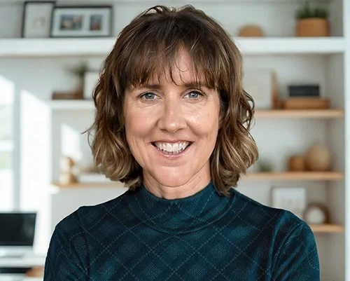 Pia Williams, biomimicry practitioner and host of Feral by Design, smiling in a portrait photo.